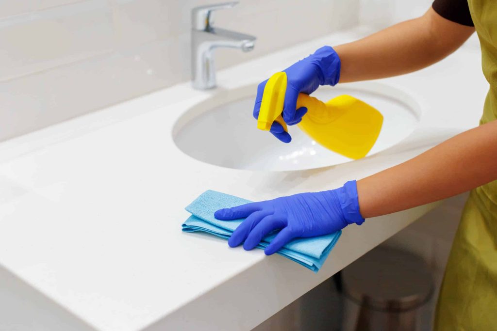Housekeeper cleaning a hotel room