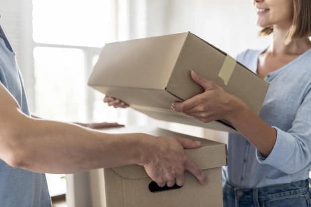 Couple with boxes moving out