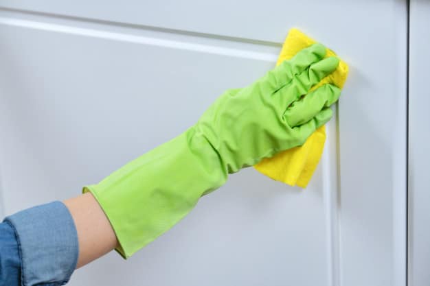 woman-gloves-with-rag-washing-cleaning-polishing-furniture-doors