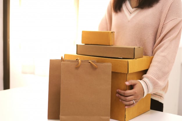 business from home woman preparing pacage deliver box shipping