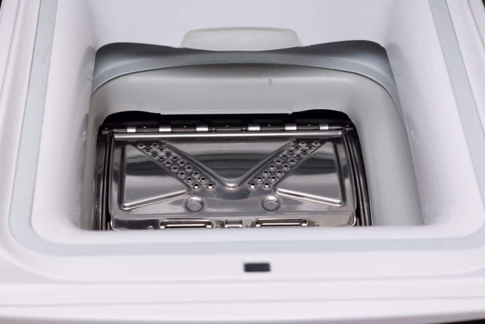 The inside of an empty top load washing machine