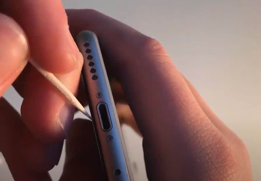 cleaning apple lightning charger port with a toothpick