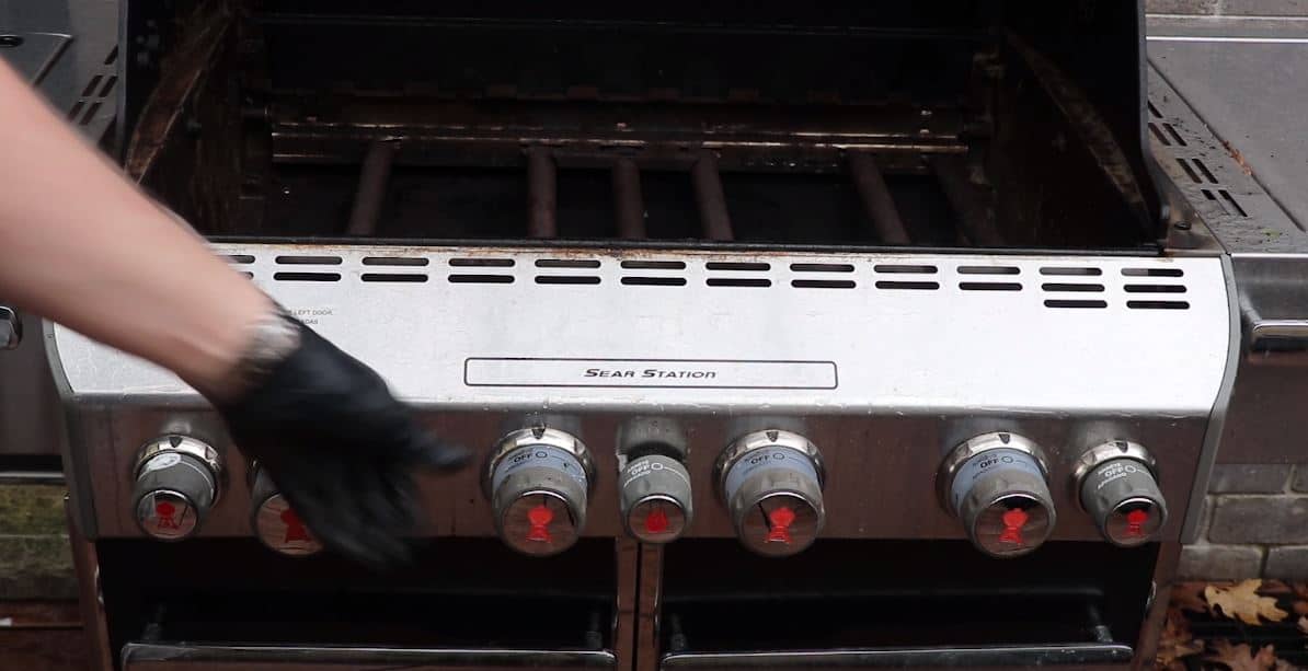 A Weber Barbeque grill during the cleaning process