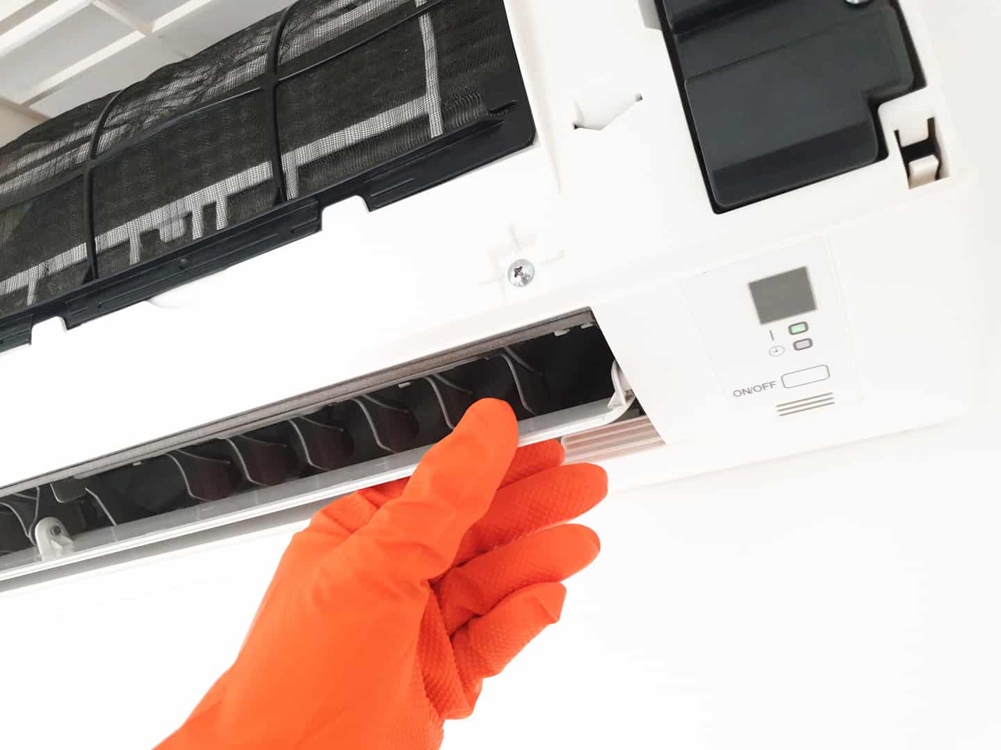 Modern airconditioner unit service cleaning the filter to preven