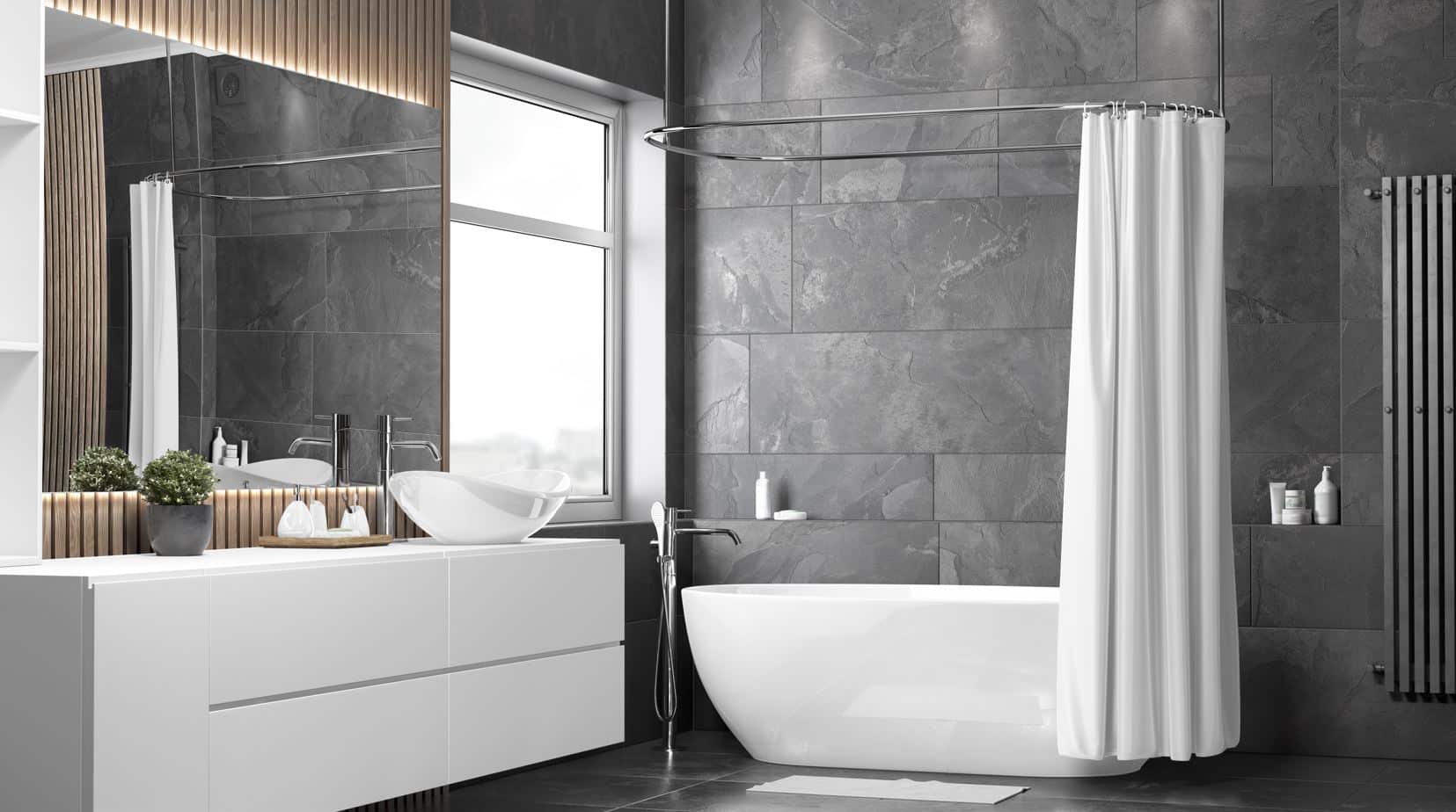 modern black inspired bathroom with a large white shower curtain hanging on the side of a large marble bathtub