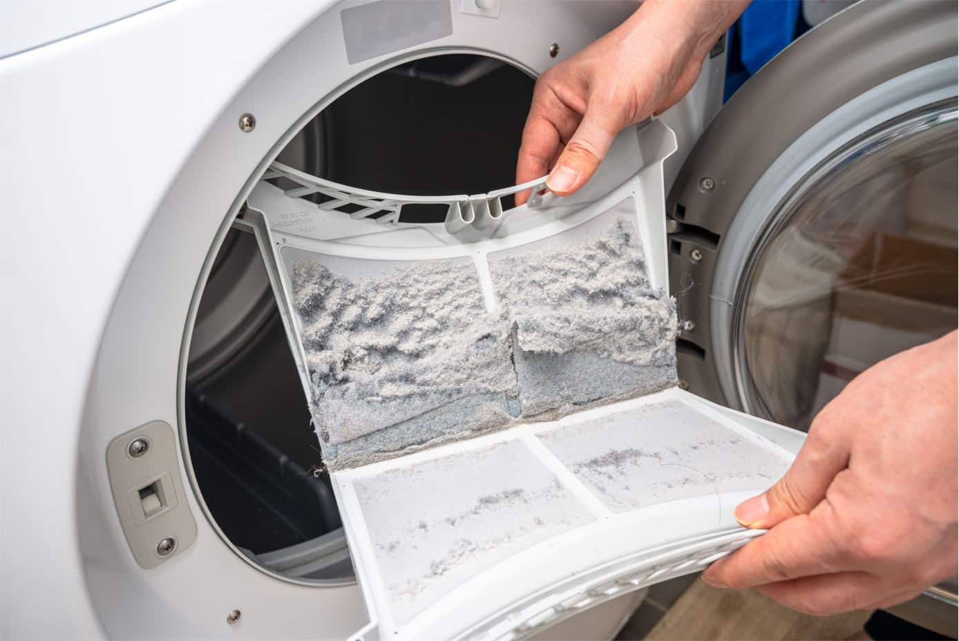 man showing full lint trap of a dryer