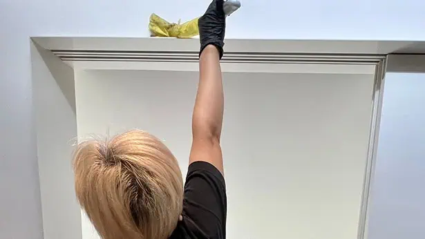 An office workspace being cleaned