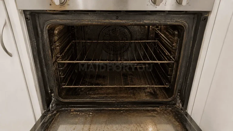 Oven before a MaidForYou oven clean